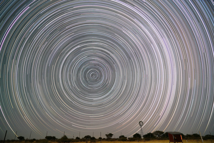 A stunning astrophotography shot of a circular pattern of star trails in the night sky